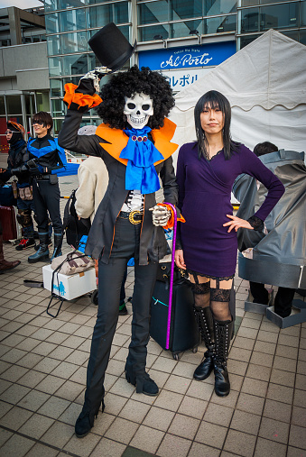 Tokyo, Japan - December 30, 2014:  Two cosplayers dressed as characters from the anime 'One Piece' at Comiket 87.