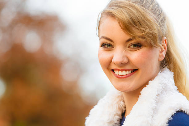 istock Young woman spend time in autumnal park. 516042718