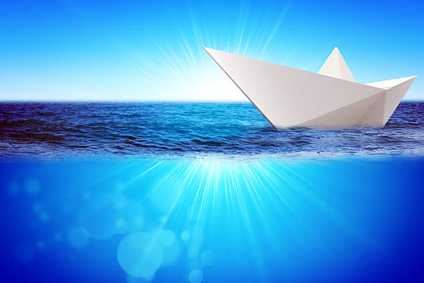 istock Origami paper boat 516047582