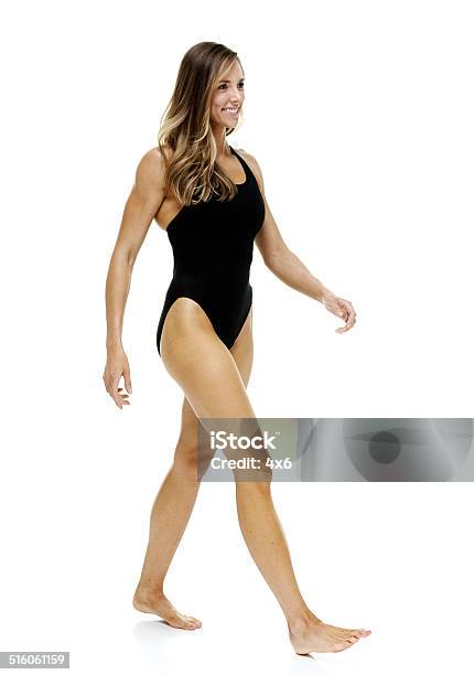 Cheerful Female Swimmer Walking Stock Photo - Download Image Now - 20-29 Years, 25-29 Years, Adult