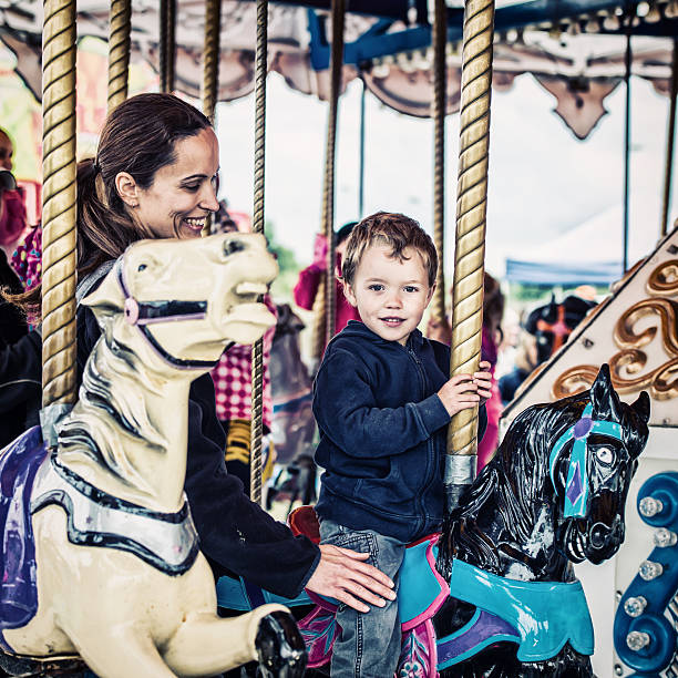 istock Boy and Mother on Carousel Together - Retro 516061325