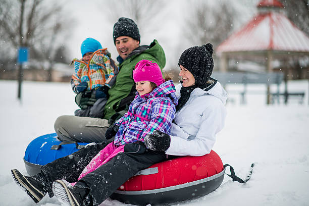 istock Tubing and sledding down a hill 516061417