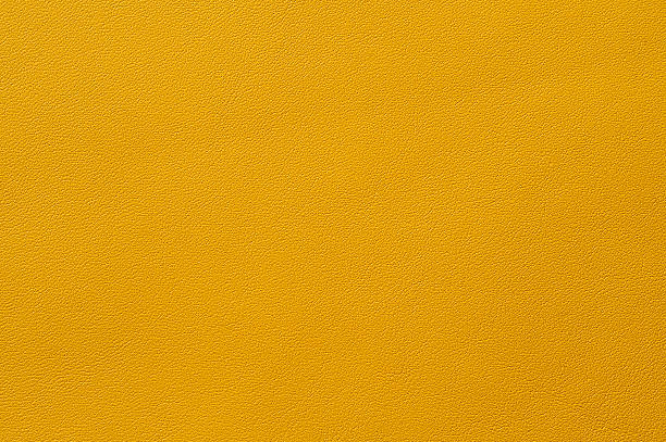 istock Closeup of seamless yellow leather texture 516061619