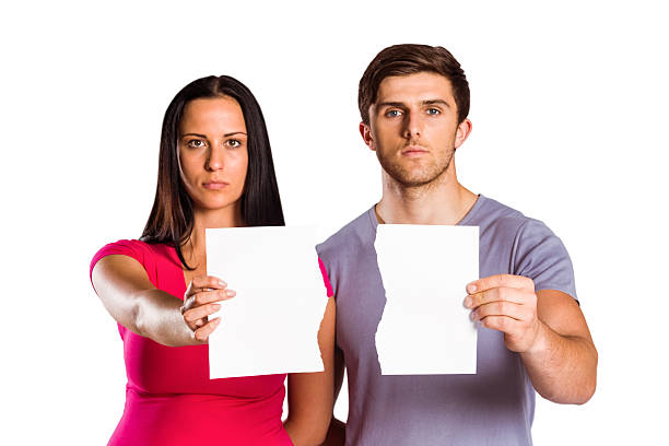 istock Couple showing broken piece of paper 516062961