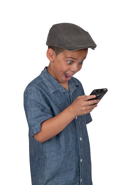 Mixed race boy with cellular phone stock photo
