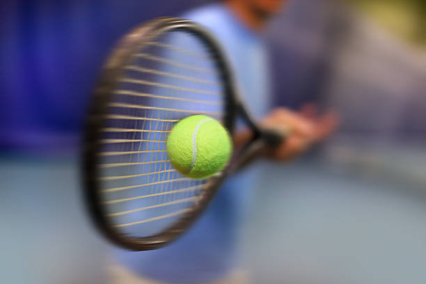 istock .male tennis player in action 516064281
