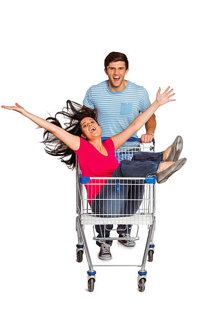 istock Young couple having fun with shopping cart 516064573