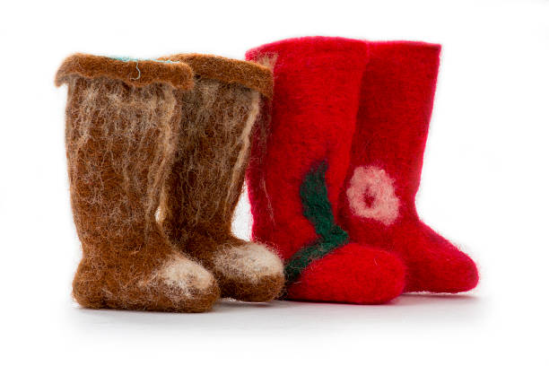 istock Souvenirs from fulled wool boots on a white background 516064852