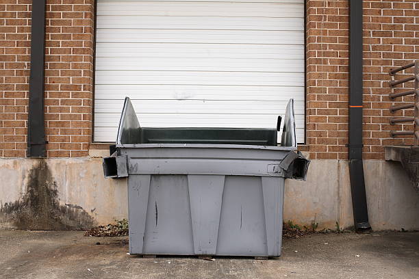 Garbage Can in Front of Warehouse Door