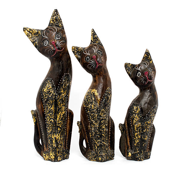 istock wooden statuette a cat isolated on white 516065298