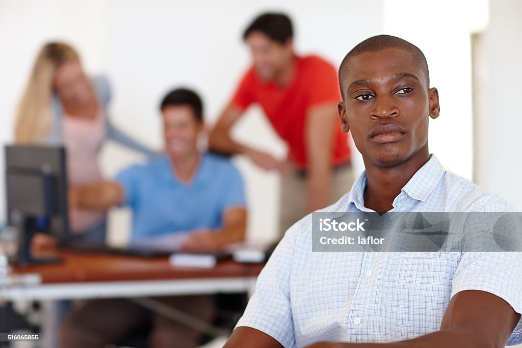 Contemplating his career Shot of a male designer looking focussed while his colleagues work in the backgroundhttp://195.154.178.81/DATA/i_collage/pu/shoots/784572.jpg Exclusion Stock Photo