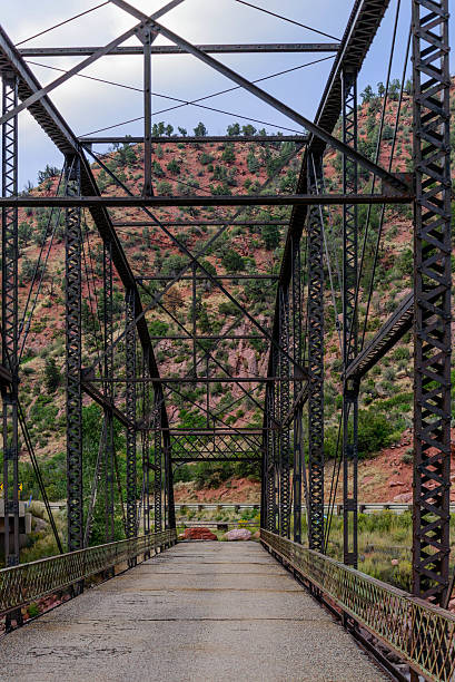 istock Steel bridge crossing a river 516066251