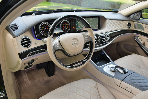 Warsaw, Poland - June, 3rd, 2015: Interior in extremely luxurious limousine Mercedes-Benz Maybach S600. This limousine is one of the most luxury and comfortable vehicles in the world. This elegant interior is made with luxury materials, for example precious wood, aluminium and cowhide.