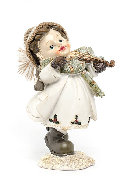 istock figurine a girl with a violin isolated on white 516068002