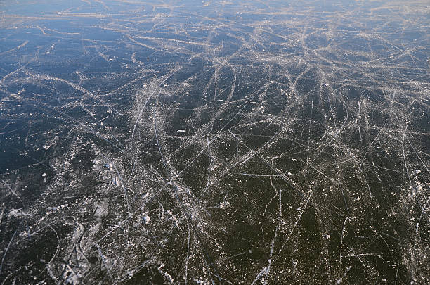 istock traces of ice skating on lake 516068080
