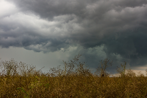 Dark stormy sky over the field