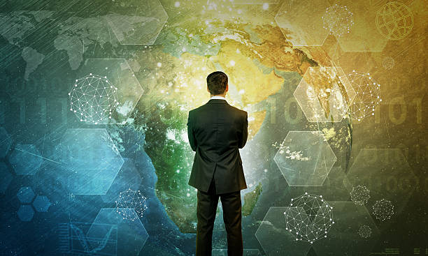 istock Businessman in front of holographic screen 516072762