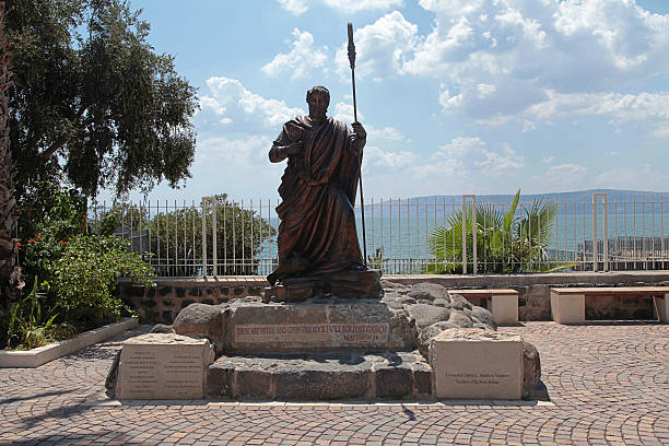 Capharnaum, Israel - August 30, 2015: Statue of apostle Saint Peter in biblical Capernaum on the coast of Galilee sea (Kinnereth), Israel. Horizontal image
