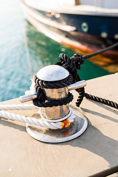 istock Ropes tied to marina bollard 516073750