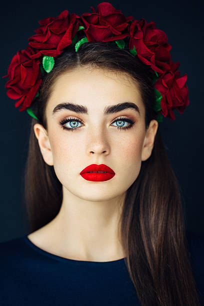 Portrait of a nice looking woman with beautiful wreath. Professional make-up