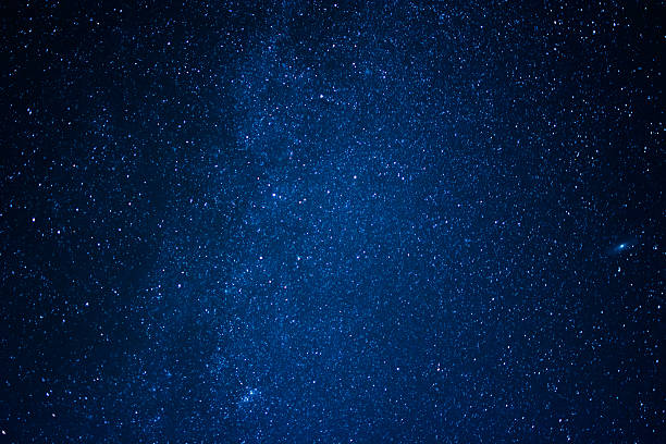 istock blue dark background of the starry sky 516075034