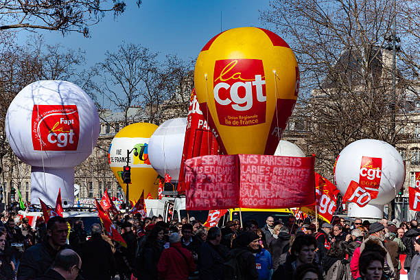 French unions and students protest against Khomri labor reform Paris, France - March 17, 2016: French unions and students protest against Khomri labor reform striker stock pictures, royalty-free photos & images