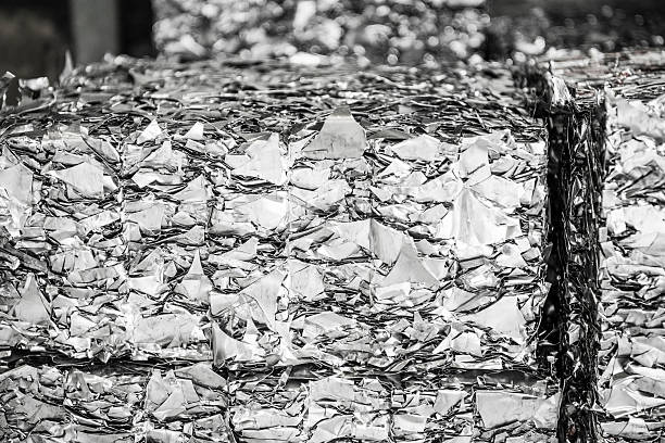 istock Aluminium metal off cuts compacted and stacked for recycling 516075742