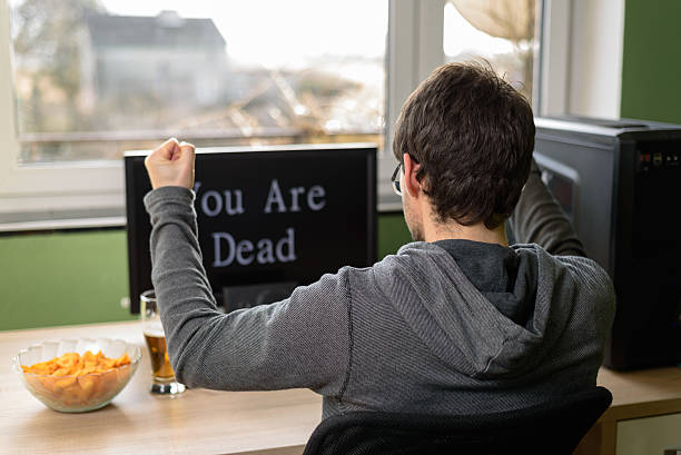 gamer, player reaction after losing in video game gamer, player reaction after losing in video game, male gamer playing video games on computer fat guy playing video games stock pictures, royalty-free photos & images