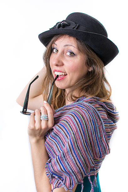 istock Happy girl posing with a hat and sunglasses 516076614