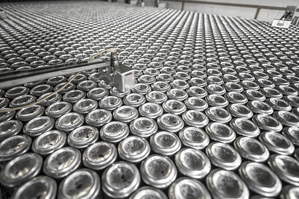 Metal equipment used to make aluminium cans Aluminium drinks cans being made in a factory. Specialist tool used in the production process. aluminum plant stock pictures, royalty-free photos & images