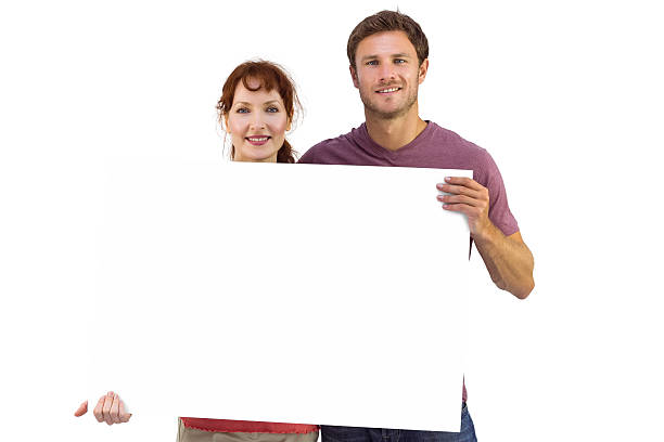istock Couple holding a white sign 516077855