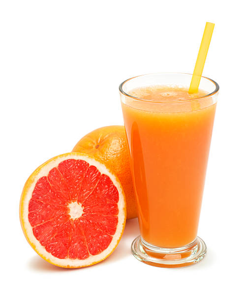 istock glass of freshly pressed grapefruit juice isolated 516078602