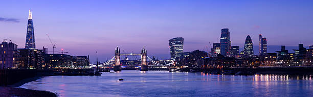 Tower Bridge and the City of London skyline sunset panorama stock photo
