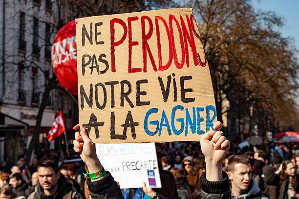 Protests in France. People take part in a protest march of the yellow vests against the rising of the fuel and oil prices. Silhouette of group of people protesting with a flag of France as a background. Vector illustration