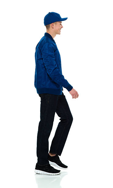 istock Smiling male walking and looking away 516078698