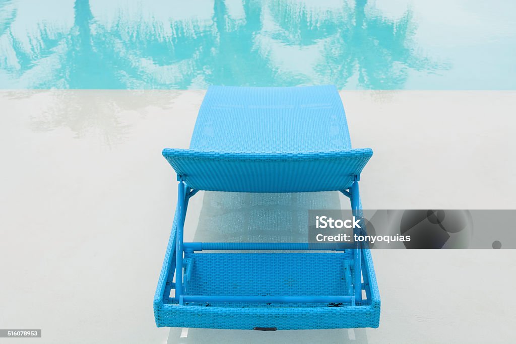 Turquoise Pool Bench Turquoise pool bench in Philippine hotel Bench Stock Photo