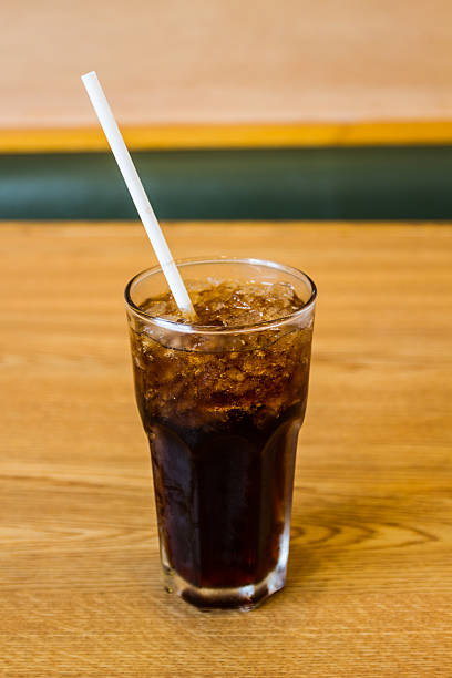 istock Glass of cola with ice cubes . 516079127