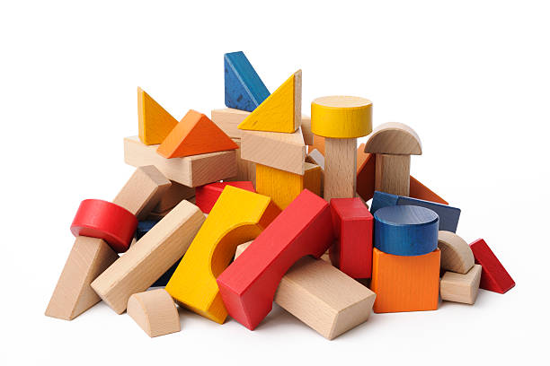 istock Isolated shot of stacked multicolored wood blocks on white background 516079183