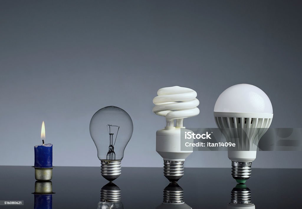 Kerze, Kunstlicht Glühbirne, Leuchtstofflampe und LED-Leuchtmittel - Lizenzfrei Evolution Stock-Foto