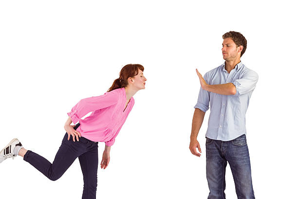 istock Man stopping woman from kissing 516082137