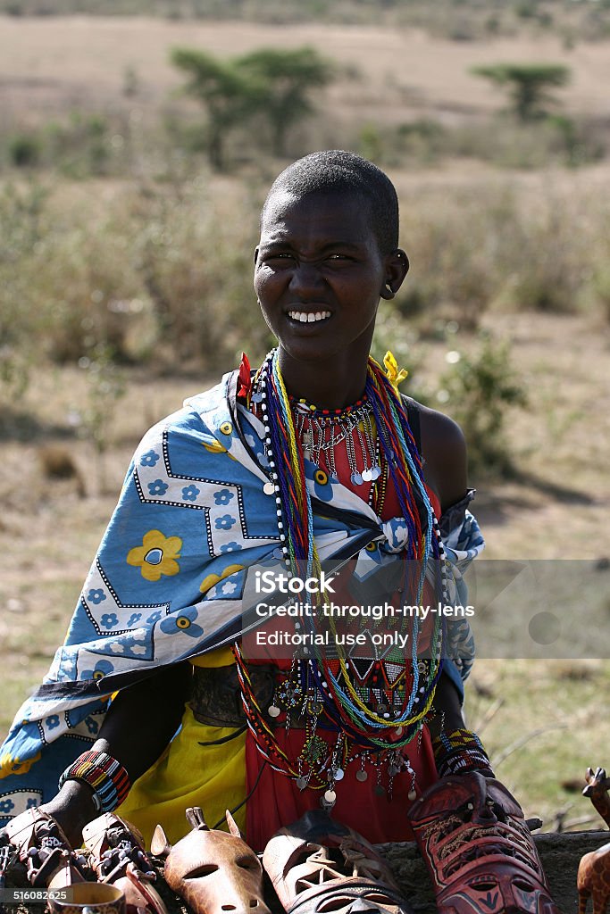 Masai People in village Kenya, Africa - October 25, 2007: Colorfully dressed Masai People in village located in Kenya Africa Adult Stock Photo