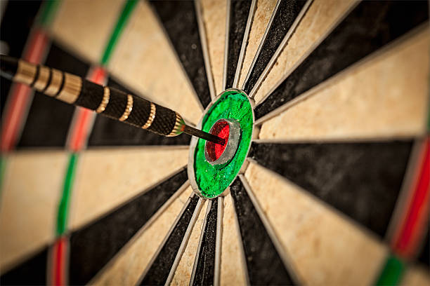 istock Dart in bull's eye close up 516084131