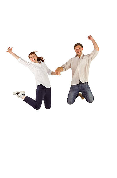 istock Couple jumping and holding hands 516084181