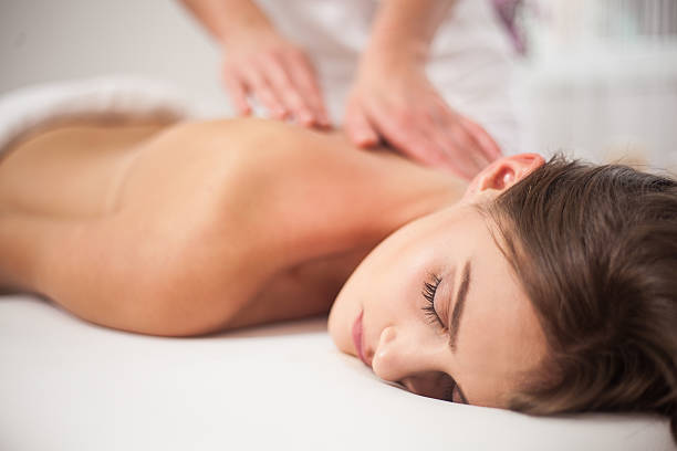 istock Young woman receiving back massage at spa 516099766