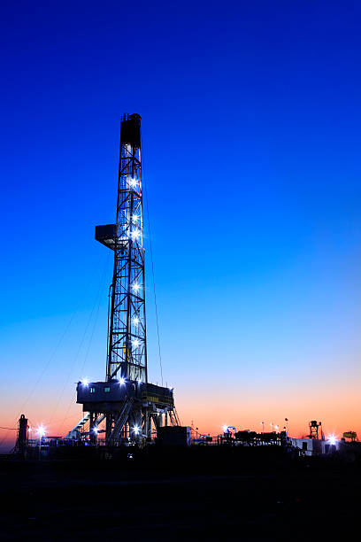 oilfield derrick at night oilfield derrick at night dental drill stock pictures, royalty-free photos & images