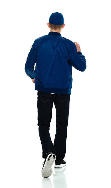 istock Rear view of male walking 516101244