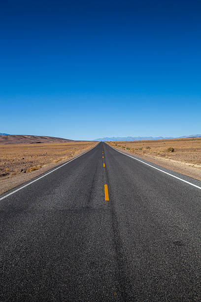 istock Endless straight road in Death Valley National Park 516102246
