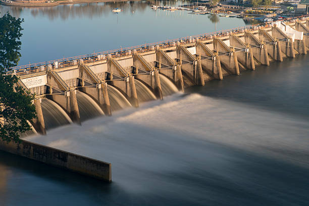 Water Reservoir Release Drinking lake Dam Nimbus Natoma Conservation Drought A long exposure of a water release through 6 of the spillway gates from Nimbus Dam Sacramento, CA reservoir stock pictures, royalty-free photos & images