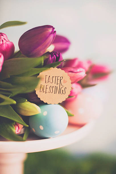 istock Easter arrangement with Easter tulips and blessings message 516103426