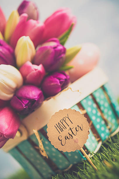 istock Easter arrangement with Easter basket and tulips 516103458